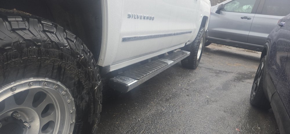 White Chevrolet Silverado, side view, repaired in Schenectady, NY